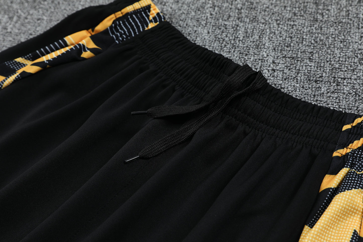 Kit Tank Top + Shorts Real Madrid Black/Orange Training 24/25