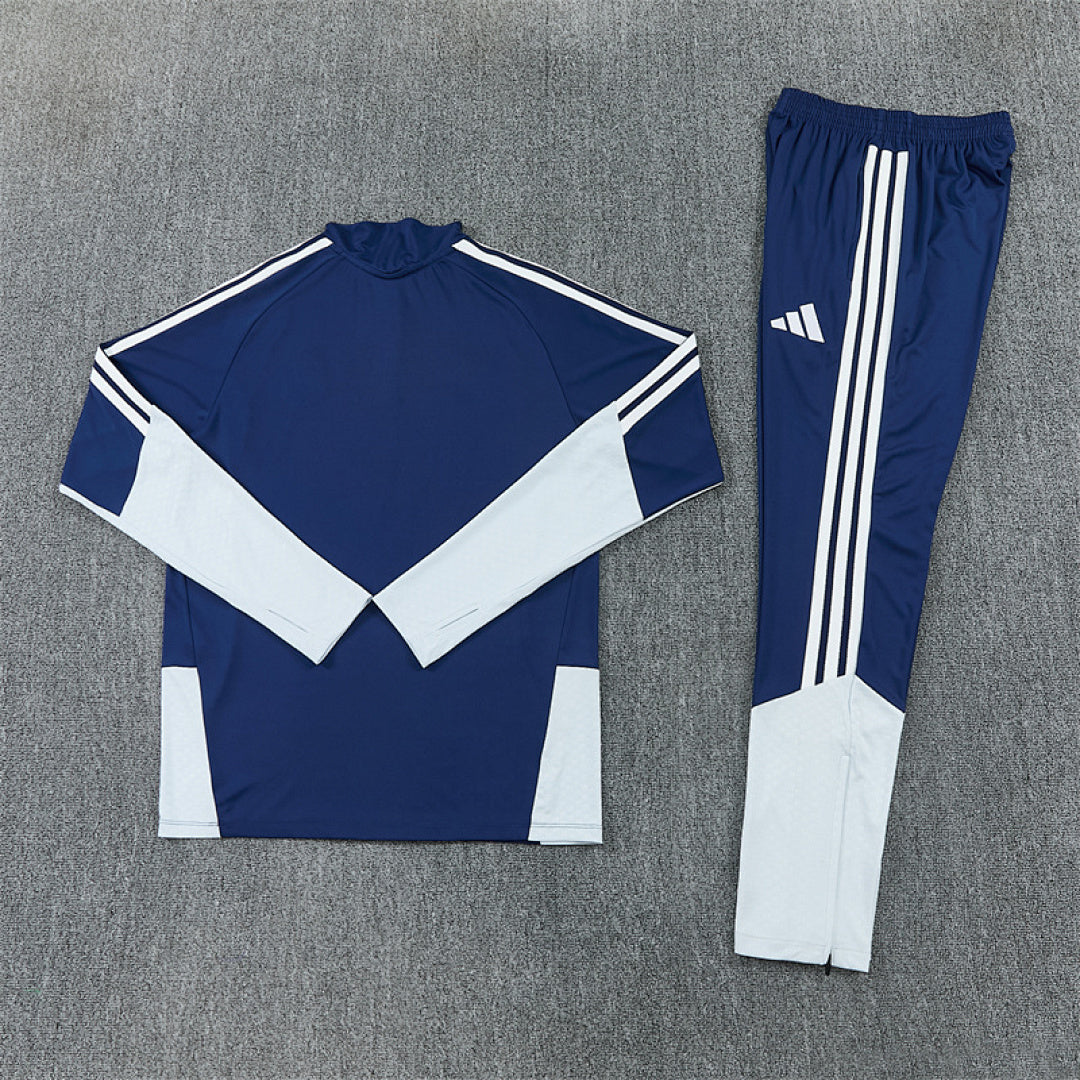 Tuta Real Madrid Blu Half-Zip 26/27 Uomo | Tuta da Calcio - CalcioVivo