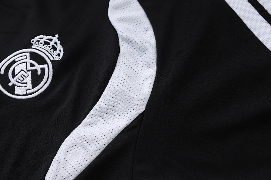 Tuta Real Madrid Nero/Bianco Half-Zip 26/27 Uomo | Tuta da Calcio - CalcioVivo