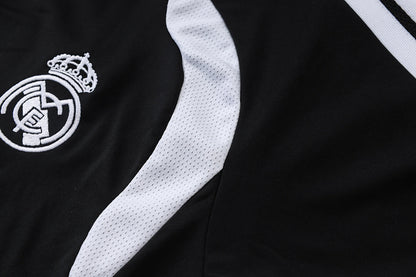 Tuta Real Madrid Nero/Bianco Half-Zip 26/27 Uomo | Tuta da Calcio - CalcioVivo
