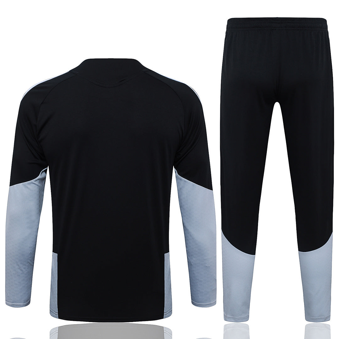 Tuta Real Madrid Nero/Bianco Half-Zip 26/27 Uomo | Tuta da Calcio - CalcioVivo