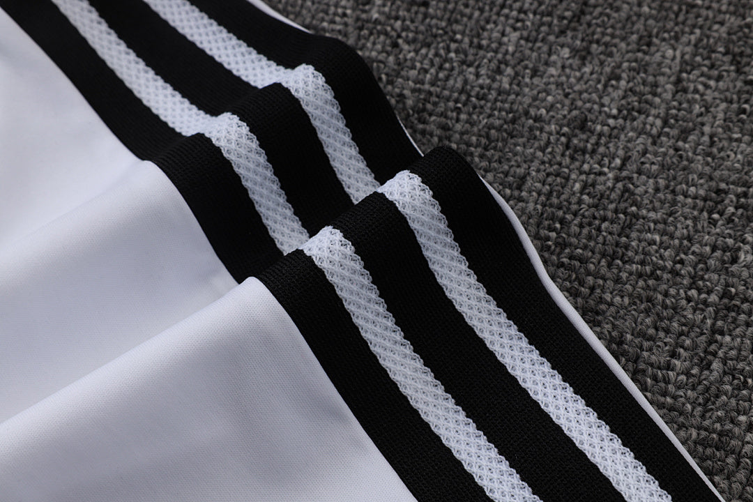 Tuta Real Madrid Bianco/Nero Half-Zip 26/27 Uomo | Tuta da Calcio - CalcioVivo
