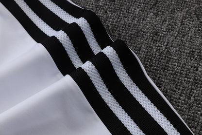 Tuta Real Madrid Bianco/Nero Half-Zip 26/27 Uomo | Tuta da Calcio - CalcioVivo