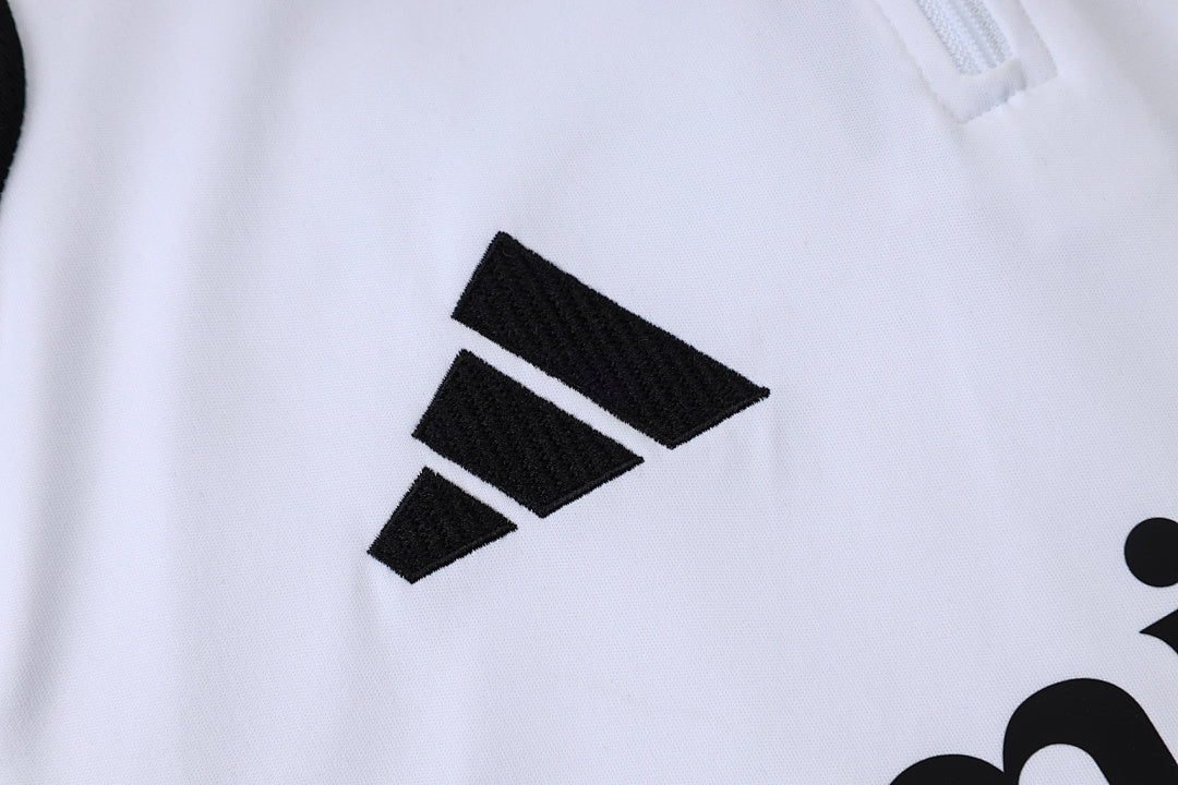 Tuta Real Madrid Bianco/Nero Half-Zip 26/27 Uomo | Tuta da Calcio - CalcioVivo