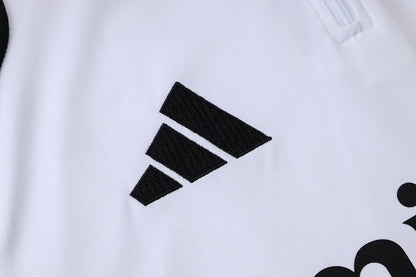 Tuta Real Madrid Bianco/Nero Half-Zip 26/27 Uomo | Tuta da Calcio - CalcioVivo