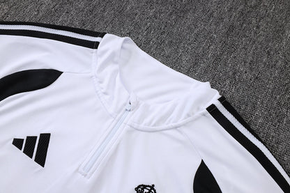 Tuta Real Madrid Bianco/Nero Half-Zip 26/27 Uomo | Tuta da Calcio - CalcioVivo