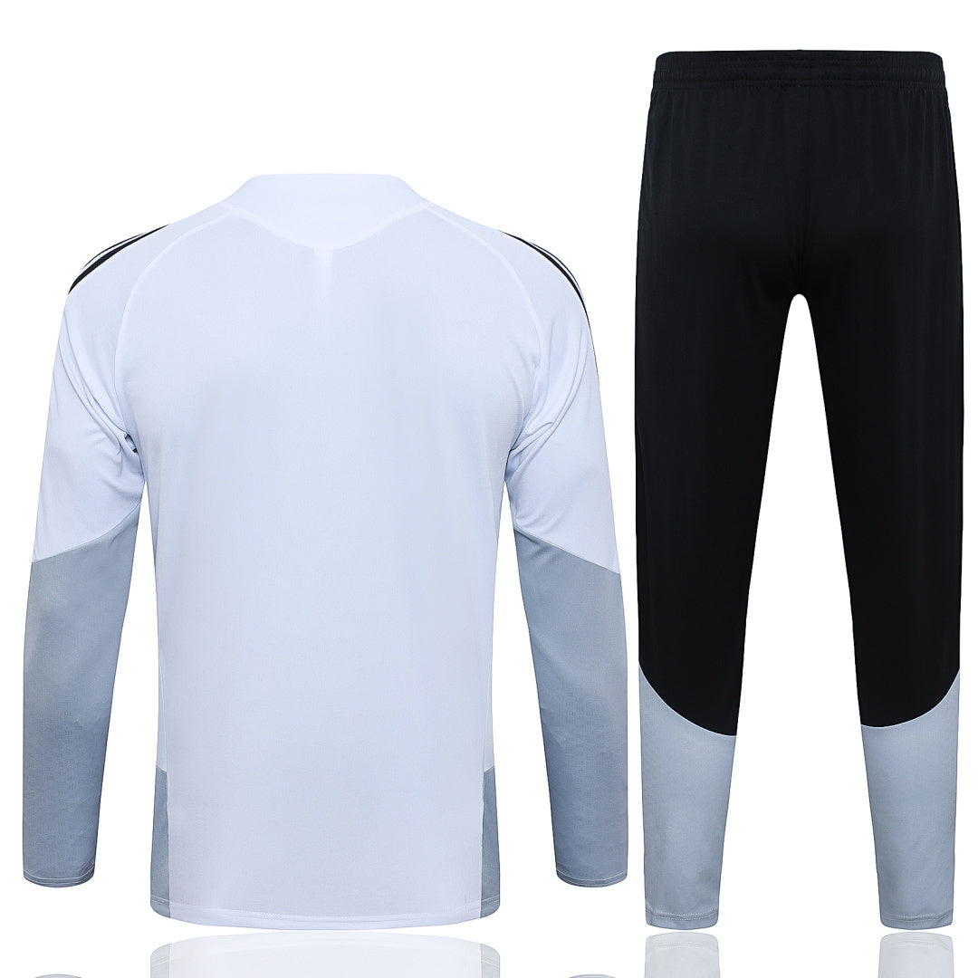 Tuta Real Madrid Bianco/Nero Half-Zip 26/27 Uomo | Tuta da Calcio - CalcioVivo