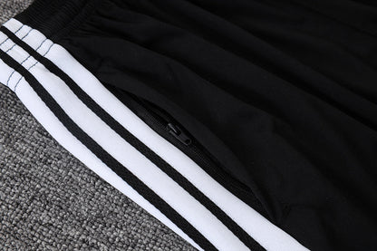 Tuta Real Madrid Nero/Bianco Half-Zip 26/27 Uomo | Tuta da Calcio - CalcioVivo