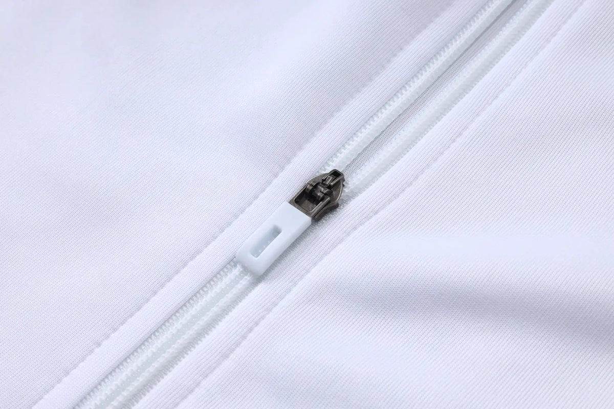 Tuta Full-zip Real Madrid 26/27 Uomo Bianco e Verde Petrolio | Tuta da Calcio - CalcioVivo