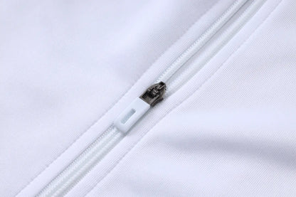 Tuta Full-zip Real Madrid 26/27 Uomo Bianco e Verde Petrolio | Tuta da Calcio - CalcioVivo