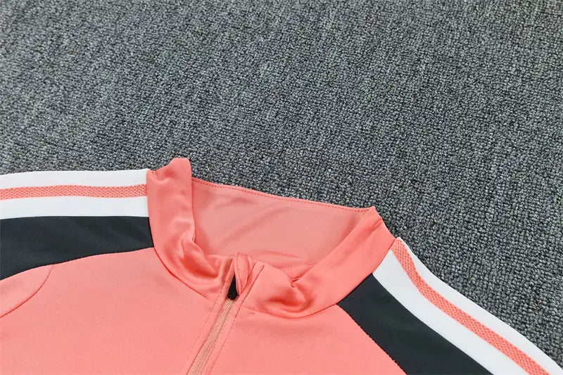 Tuta Half-zip Real Madrid 26/27 Uomo Rosa Corallo | Tuta da Calcio - CalcioVivo